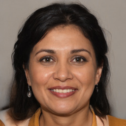 Joyful white adult female with medium  brown hair and brown eyes