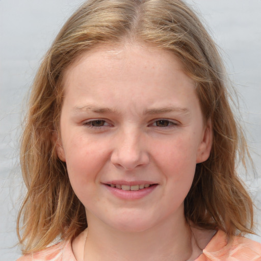 Joyful white child female with medium  brown hair and blue eyes