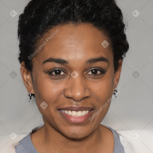 Joyful black young-adult female with short  black hair and brown eyes