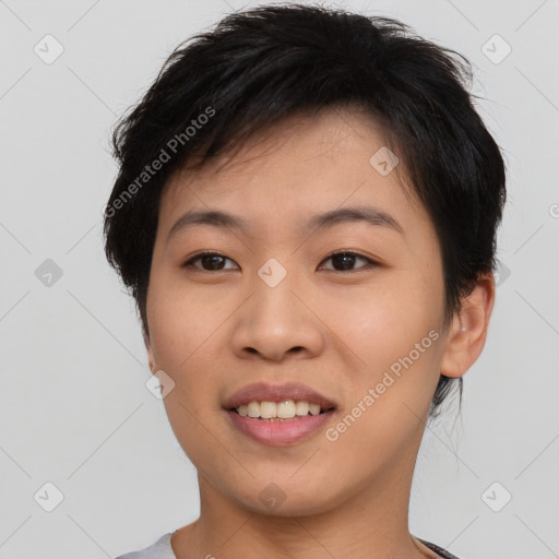 Joyful asian young-adult female with short  black hair and brown eyes