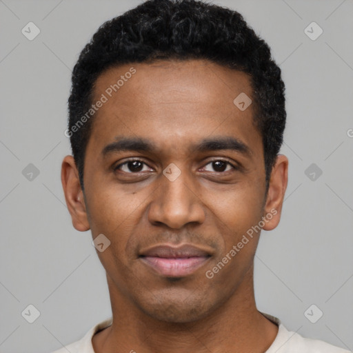 Joyful black young-adult male with short  black hair and brown eyes