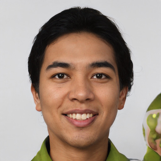 Joyful white young-adult male with short  black hair and brown eyes
