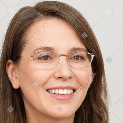 Joyful white young-adult female with long  brown hair and blue eyes