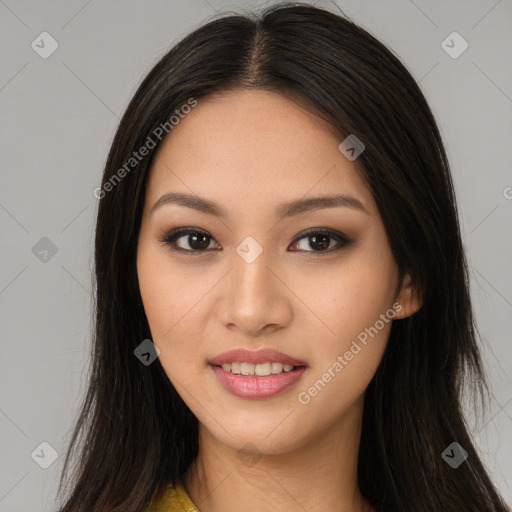 Joyful asian young-adult female with long  brown hair and brown eyes