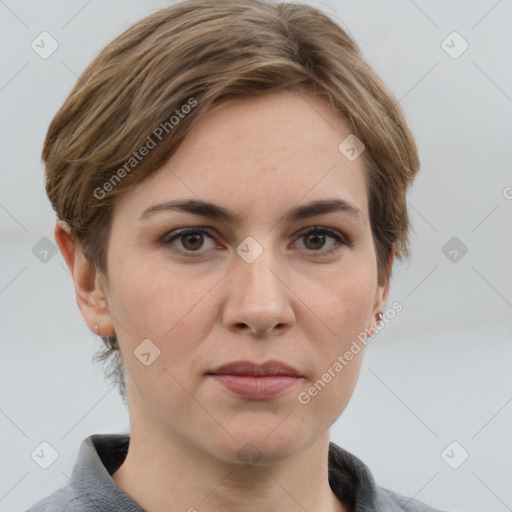 Joyful white adult female with short  brown hair and grey eyes