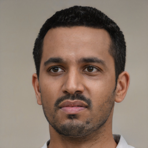 Neutral black young-adult male with short  black hair and brown eyes