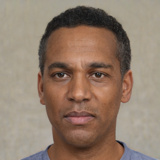 Neutral black adult male with short  black hair and brown eyes