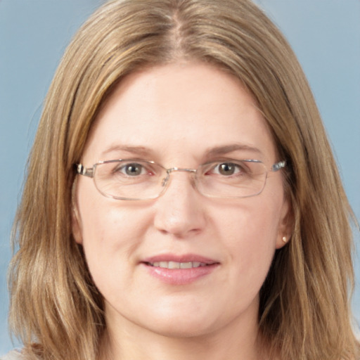 Joyful white adult female with long  brown hair and grey eyes