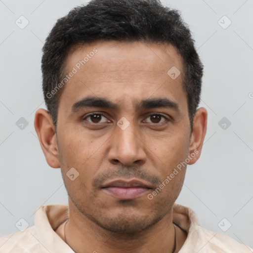 Neutral latino young-adult male with short  brown hair and brown eyes