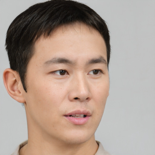 Neutral white young-adult male with short  brown hair and brown eyes