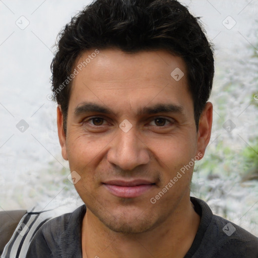 Joyful white adult male with short  black hair and brown eyes