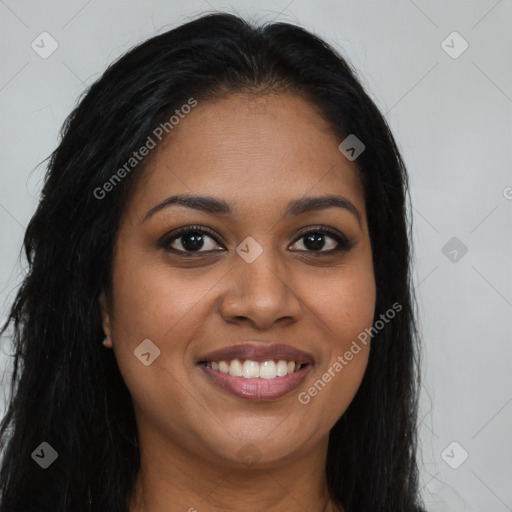 Joyful black young-adult female with long  brown hair and brown eyes