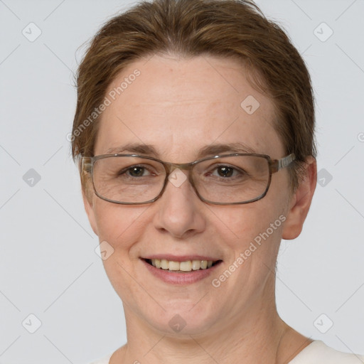 Joyful white adult female with short  brown hair and grey eyes