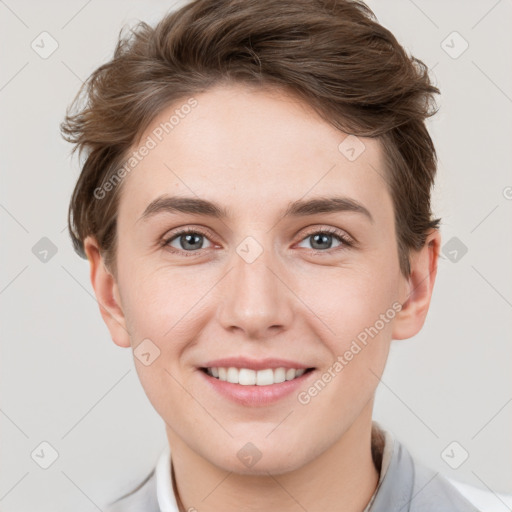 Joyful white young-adult female with short  brown hair and grey eyes