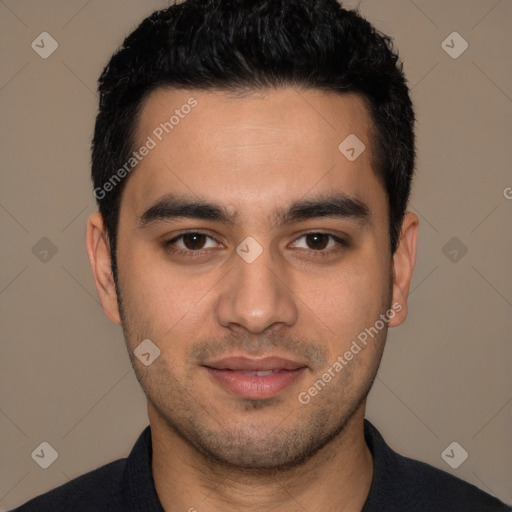 Joyful white young-adult male with short  black hair and brown eyes