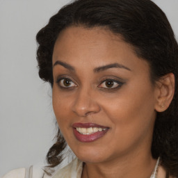 Joyful black young-adult female with medium  brown hair and brown eyes