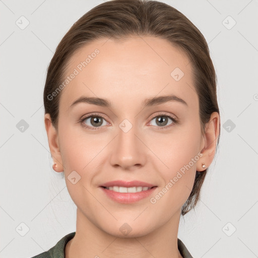 Joyful white young-adult female with medium  brown hair and grey eyes