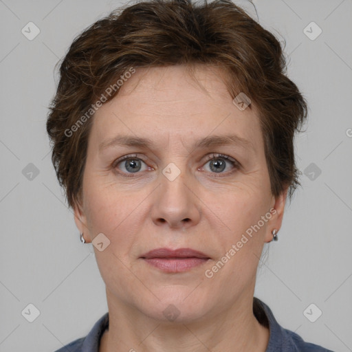 Joyful white adult female with short  brown hair and grey eyes