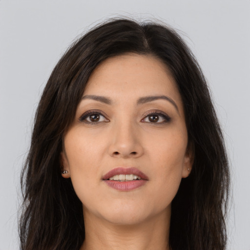 Joyful asian young-adult female with long  brown hair and brown eyes