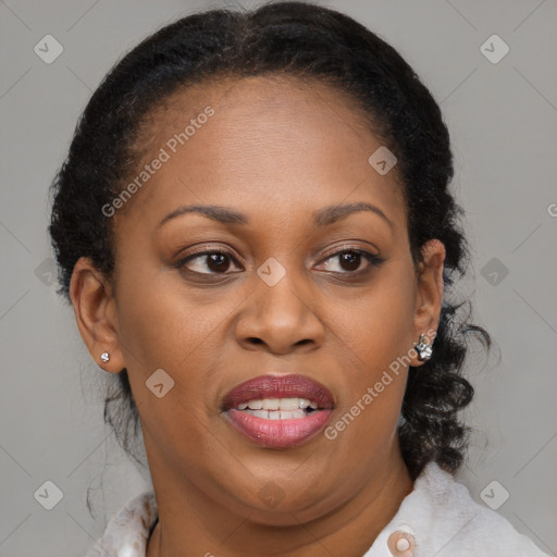 Joyful black adult female with medium  brown hair and brown eyes