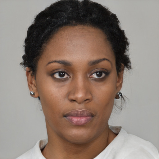 Neutral black young-adult female with short  black hair and brown eyes