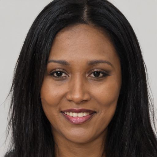 Joyful asian young-adult female with long  brown hair and brown eyes