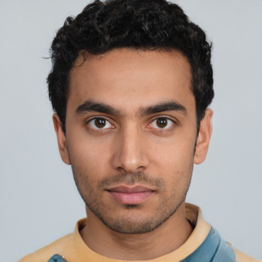 Neutral latino young-adult male with short  black hair and brown eyes
