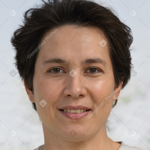 Joyful white adult female with short  brown hair and brown eyes