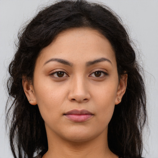 Neutral latino young-adult female with long  brown hair and brown eyes