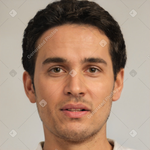 Joyful white young-adult male with short  black hair and brown eyes