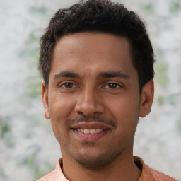 Joyful latino young-adult male with short  brown hair and brown eyes