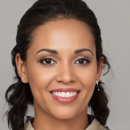 Joyful white young-adult female with medium  brown hair and brown eyes