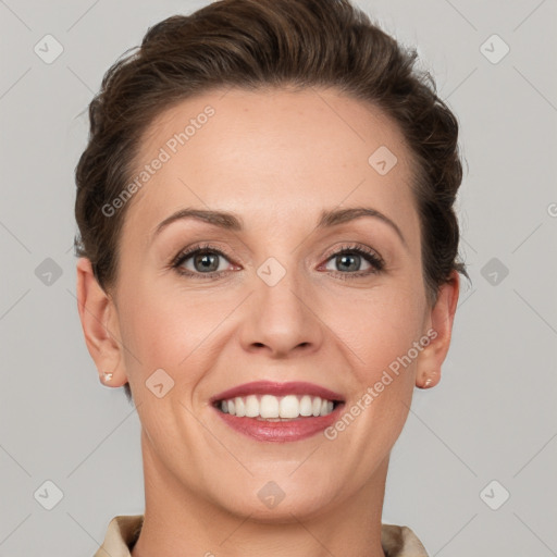 Joyful white adult female with short  brown hair and grey eyes