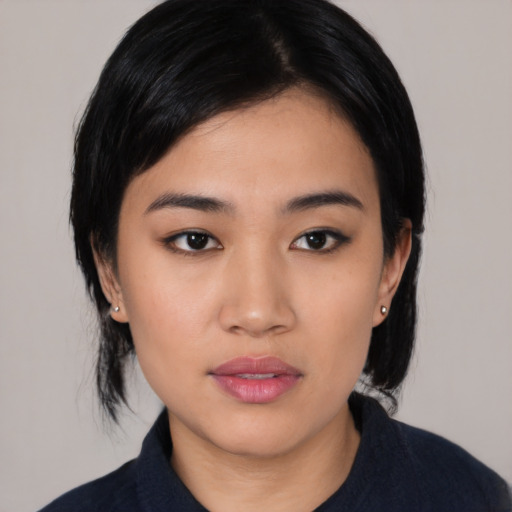 Neutral asian young-adult female with medium  black hair and brown eyes