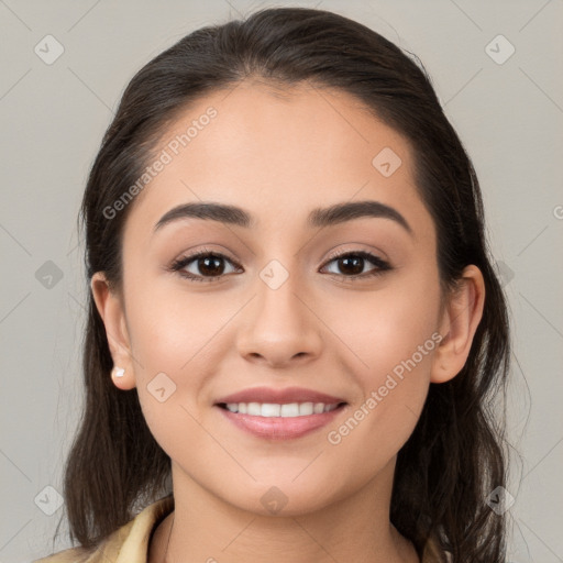 Joyful white young-adult female with long  brown hair and brown eyes