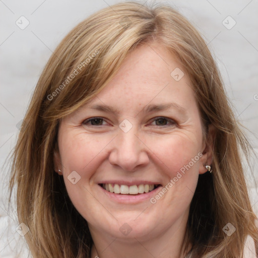 Joyful white adult female with medium  brown hair and grey eyes