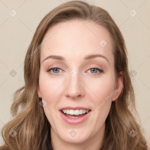 Joyful white young-adult female with long  brown hair and green eyes