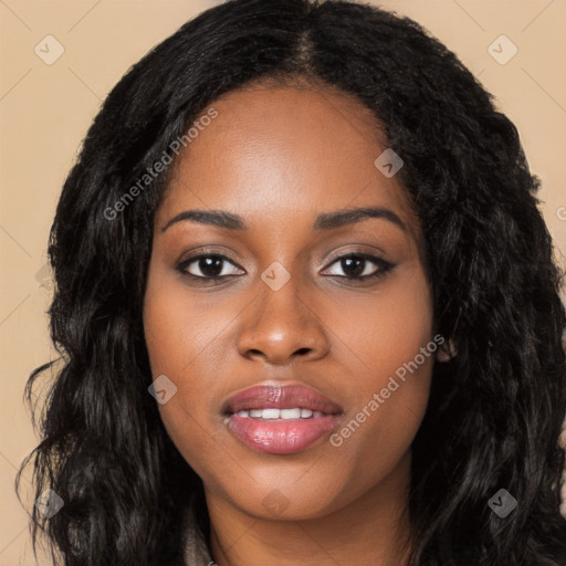 Joyful black young-adult female with long  black hair and brown eyes