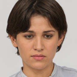 Neutral white young-adult female with short  brown hair and brown eyes