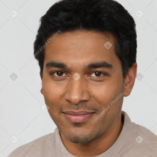 Joyful latino young-adult male with short  black hair and brown eyes