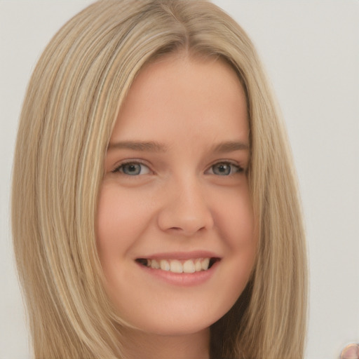 Joyful white young-adult female with long  blond hair and brown eyes