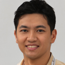 Joyful asian young-adult male with short  black hair and brown eyes