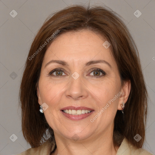 Joyful white adult female with medium  brown hair and brown eyes