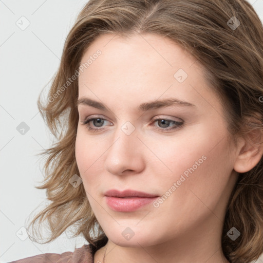 Joyful white young-adult female with long  brown hair and blue eyes