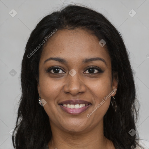 Joyful black young-adult female with long  brown hair and brown eyes