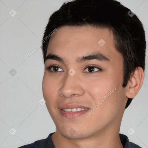 Joyful asian young-adult male with short  black hair and brown eyes