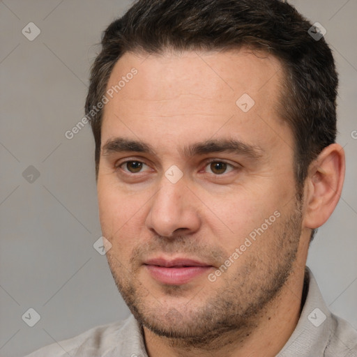 Joyful white young-adult male with short  brown hair and brown eyes