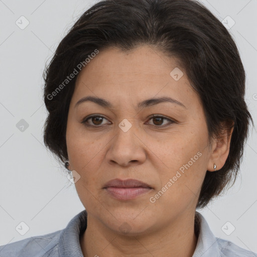 Joyful white adult female with medium  brown hair and brown eyes