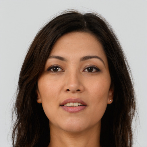 Joyful asian young-adult female with long  brown hair and brown eyes
