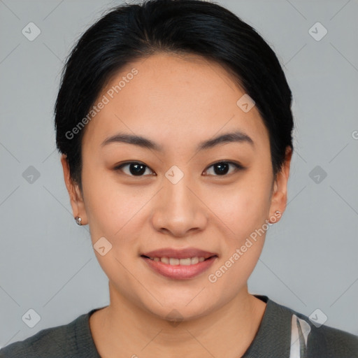 Joyful asian young-adult female with short  black hair and brown eyes